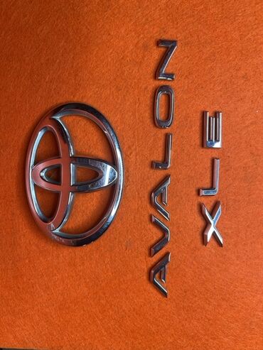 runx alex: Toyota avalon
2010
Эмблема багажника