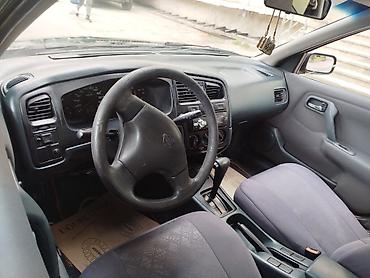 byd satisi: Nissan Primera: 0.2 l | 1998 il Sedan — 4