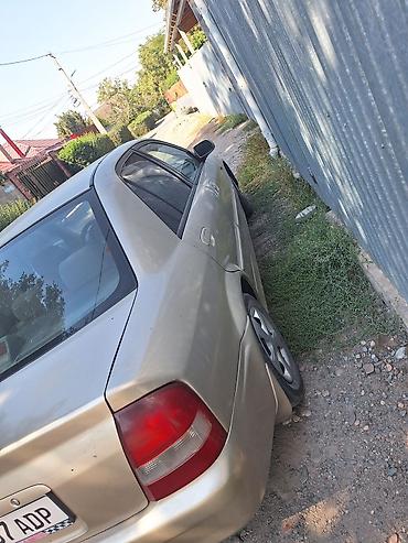 mini coper: Mazda 323: 2000 г., 1.5 л, Автомат, Бензин, Седан — 6