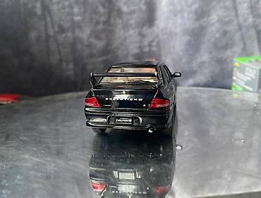 Avtomobil modelləri: Коллекционная модель Mitsubishi Lancer Evolution VII black 2002 — 8