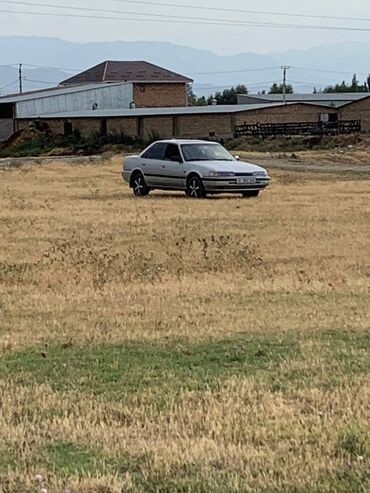 хундай гетс машина: Автомобиль Mazda 626 в кузове седан, представленный в серебристом