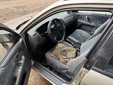 пленка авто: Mazda 323: 1998 г., Механика, Бензин, Седан — 6