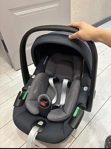 Детский мир: Детское автокресло-переноска Maxi-Cosi с базой Isofix - Категория — 1