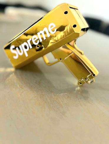 oyuncaq pul: Məhsul: Supreme qızılı “Money Gun” (pul atıcı) Təsvir: - Parlaq — 3