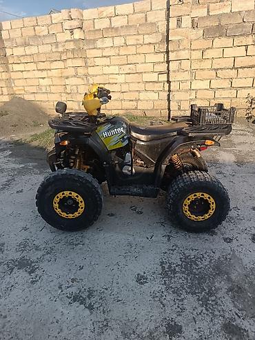 lider diski per page 40: Hunter markalı kvadrosikl. Qara-sarı rəng kombinasiya­sında, off-road — 2