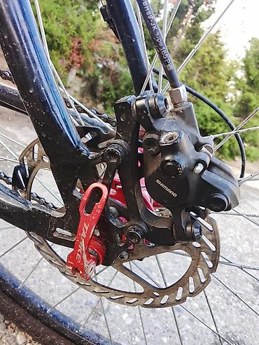 velosiped motor: Disk əyləcli dağ/şəhər tipli velosiped. Qara rəngli çərçivə, bənövşəyi — 1