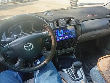 mers e210: Mazda 323: 2002 г., Механика, Хэтчбэк — 6