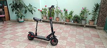 mikrafon şur: **KugooKirin M4 Pro+ elektrik skuter** Cəmi 17 km məsafə qət edib — 7