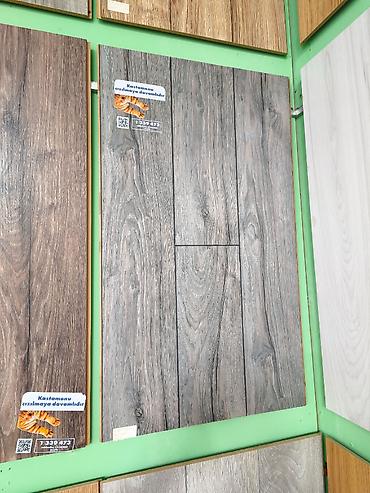 laminant: Laminat döşəmə panelləri – ağac teksturalı, tünd-boz rəng palitrası - — 1