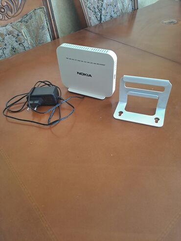 Электронные книги: Nokia brendinə məxsus bu ONT modemi Cihaz optik şəbəkə terminallarına