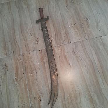 Metal məhsulları: Məhsul: Metal qılınc – bıçaq ucunda iki dişli, dekorativ oyma yazılı — 2