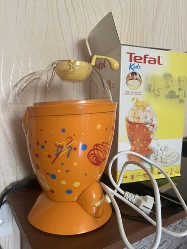 Духовки: Tefal Kids popkorn aparatı. Şəffaf qapağı və qarğıdalı üçün sarı ölçü