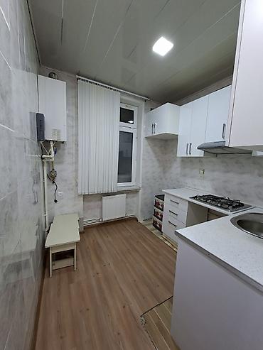 bakıda kreditle evler: 2 mərtəbəli binanın 1ci mərtəbəsi,qanuni 2 otaqlı,43kv+27kv artırma — 9