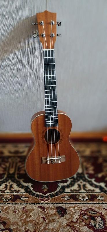 ukulele gitar: Ukulele – sopran ölçü - Korpus: təbii ağac örtüklü,o rezonans deşik — 1