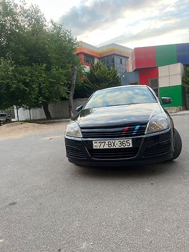 mini cooper 2009: Marka/model: Opel Astra H (hatchback, 5 qapı) Rəng: qara (parlaq) — 1