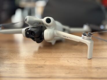 скупка стиральных машин бу бишкек: Квадрокоптер DJI Mini 4 Pro в светло-сером корпусе оснащен камерой на