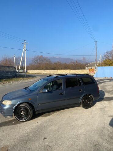 Opel: Model: Opel Astra Caravan (universal kuzov) Rəng: tünd boz Yanacaq — 9