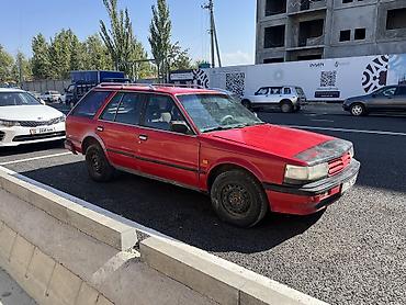 getz 2: Nissan Bluebird: 1987 г., 2 л, Механика, Бензин, Универсал — 4