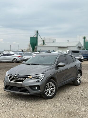 Renault: Серый кроссовер Renault Samsung XM3. Этот автомобиль сочетает в себе