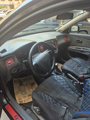 Kia: Kia Rio: 1.4 l | 2009 il Sedan — 16