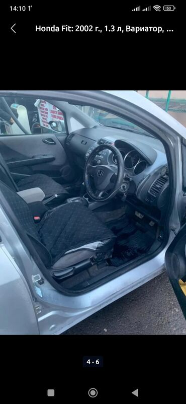 портер ош рынок: Хэтчбек Honda Fit 2002 года выпуска серебристого цвета, оснащенный