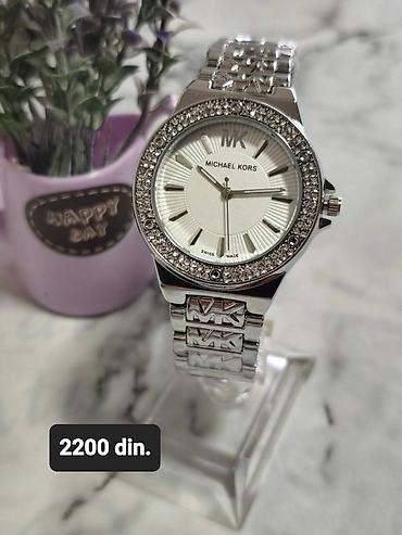 cena ove torbe: Michael Kors ženski ručni sat - Model sa okruglim kućištem u srebrnoj — 1