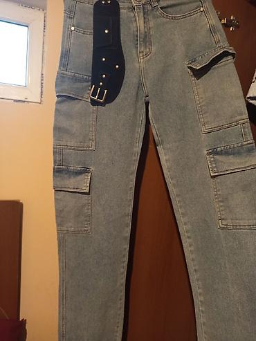 deniz geyimi: Kişi üçün cargo stilində cins şalvar. Açıq mavi/solğun denim — 1