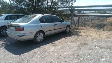 набор ключей в чемодане цена: Серебристый автомобиль Nissan Primera P11 в кузове хэтчбек. Оснащен