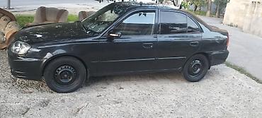 pər: Hyundai Accent: 1.5 l | 2005 il Sedan — 4