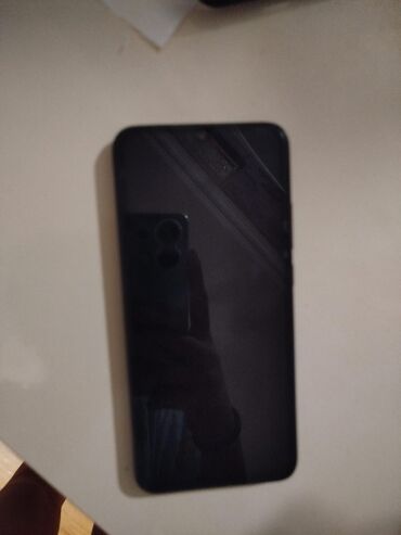 телефон fly ds169: Xiaomi Redmi 9C, 128 ГБ, цвет - Черный, 
 Отпечаток пальца, Face ID