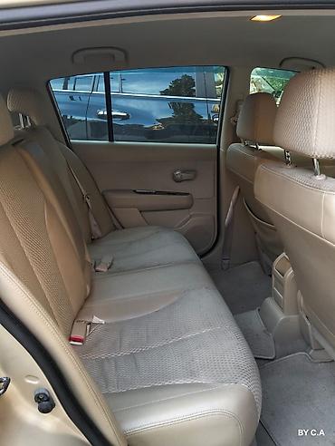 vectra stop: Nissan Tiida – hetçbek - Kuzov: 5 qapılı hetçbek, qızılı rəng - — 5