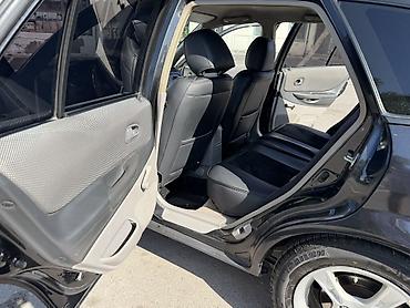 Транспорт: Mazda 323: 2002 г., 1.6 л, Механика, Бензин, Хэтчбэк — 9
