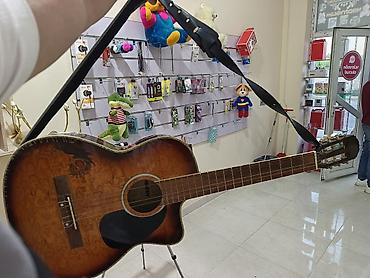 gitar satisi: Kəsikli ispan gitar çantasıda var 1 ədəd 1nci tel qırılıb baha — 1