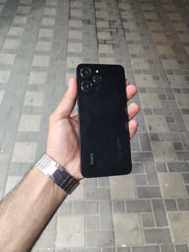 xiaomi hybrid: Xiaomi Redmi 12, 128 ГБ, цвет - Черный, 
 Кнопочный, Отпечаток пальца, Face ID