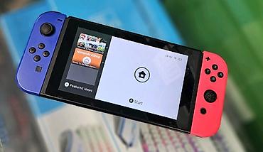 Nintendo Switch: Игровая консоль Nintendo Switch с разноцветными Joy‑Con (левый — — 1