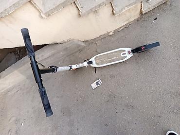 Samokatlar: Şəhər üçün mexaniki skuter - Model üzərində “Urban Scooter” yazısı - — 2