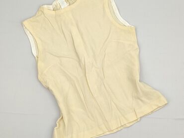 Ten damski top w kolorze jasnożółtym to klasyczny element garderoby