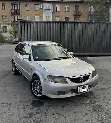 rexton j4: Mazda Familia: 2002 г., 1.6 л, Механика, Бензин, Хэтчбэк — 1