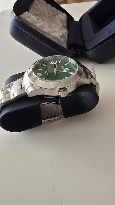 tisot sat: Nautica muški ručni sat – sportsko‑elegantni model sa zelenim — 5