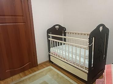 качан: Детская кроватка с маятниковым механизмом и ящиком для хранения — 2