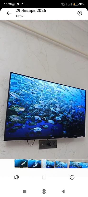 Телевизоры: Телевизор KIVI (надпись на рамке) с тонкими рамками, настенное — 5