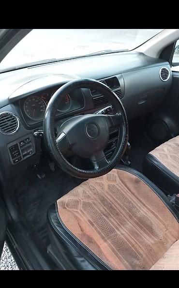 аудио касеты: Daihatsu Cuore: 2003 г., 1 л, Механика, Бензин — 3