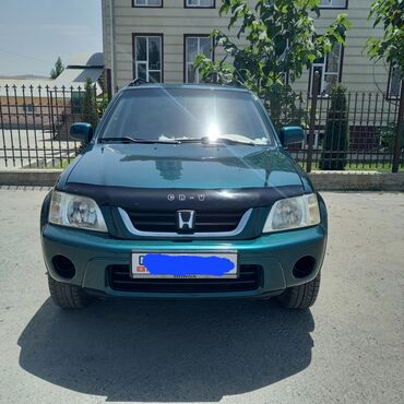 багажник для джипа: Автомобиль Honda CR-V зеленого цвета, оснащенный багажником на крыше