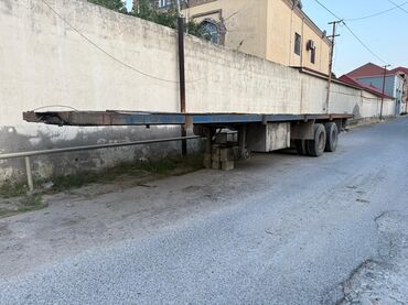 masin ucun qosqu: Yük daşımaq üçün nəzərdə tutulmuş yarımqoşqulu platformadır. Uzun və