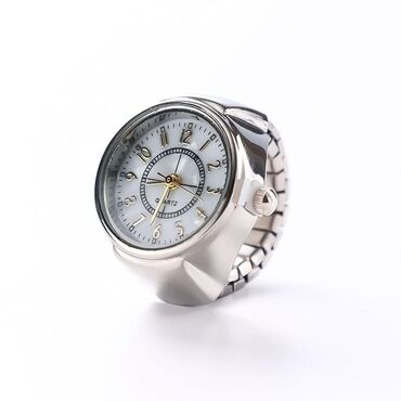 Üzüklər: ✨ Saat formalı üzük – həm fərqli, həm zərif! 💍 Polad materialdan