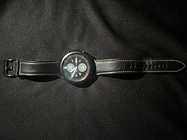 Ağıllı saat – dairəvi ekranlı, qara metal korpuslu model