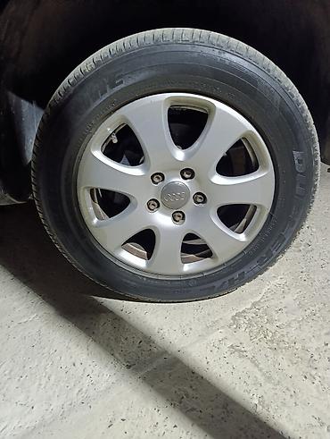 maşin tekerleri: Audi orijinal yüngül lehimli disklər və Bridgestone Dueler H/L — 5