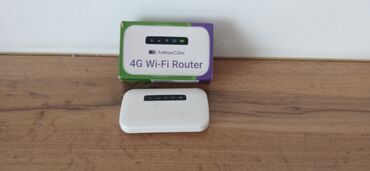купить карманный вай фай: Портативный 4G Wi-Fi роутер Megacom, выполненный в компактном белом