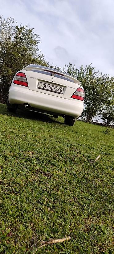 Daewoo: Daewoo Leganza, ağ rəng, sedan. Ön tərəfdən geniş xrom radiator — 4