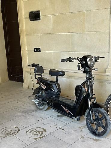 elekdirikli sukutur: Elektrik skuter – qara rəng, şəhər daxili rahat gediş üçün. Texniki — 3